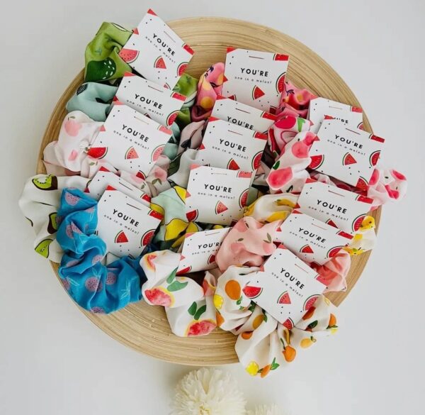 Assorted fruit-patterned scrunchies on display