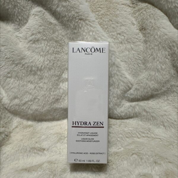 Lancôme product packaging on beige fabric
