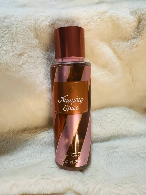 Perfume bottle on soft fabric background